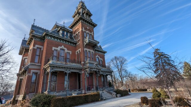 Photo of exterior of Vaile Mansion. Red brick Second Empire style mansion.